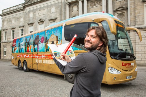 Brown Bag Films Art Director Andrew Hamilton  pictured with the Brown Bag Films bus wrap in association with Bus Eireann & ID2015. Photo: Anthony Woods